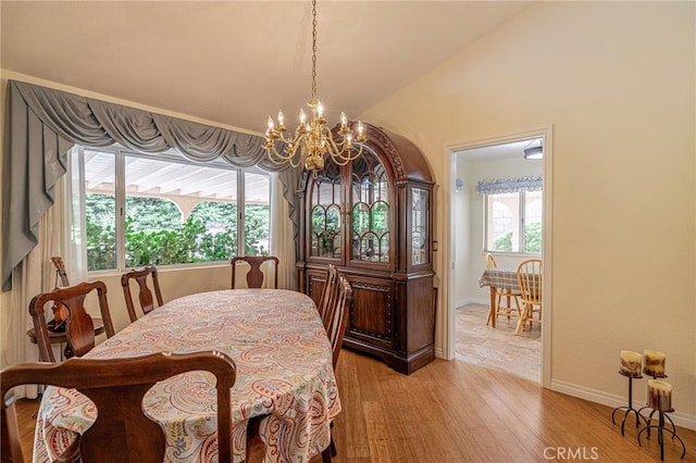5340 Gardendale Ln, Palmdale, CA 93551 - dining area with a chandelier, baseboards, light wood finished floors, and vaulted ceiling