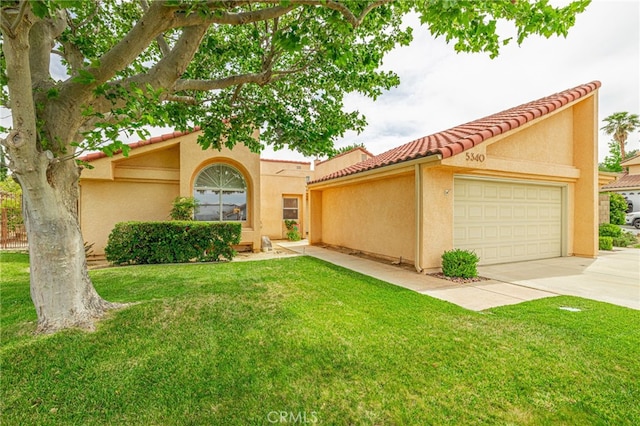 5340 Gardendale Ln, Palmdale, CA 93551 - mediterranean / spanish-style house with a garage, a tiled roof, concrete driveway, a front yard, and stucco siding