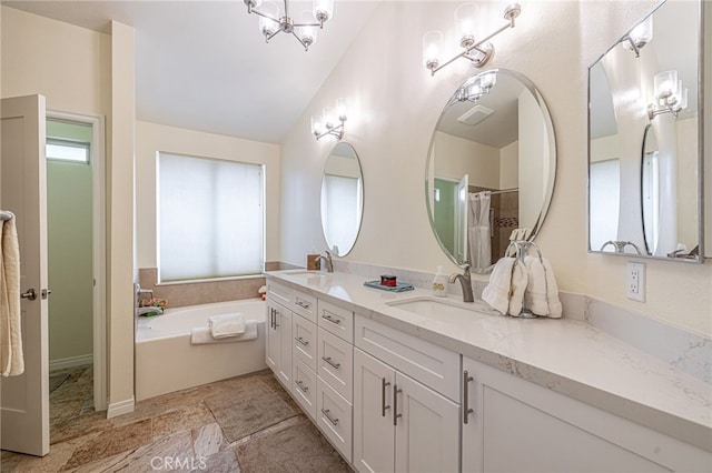 5340 Gardendale Ln, Palmdale, CA 93551 - bathroom featuring double vanity, a bath, and vaulted ceiling