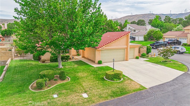 5340 Gardendale Ln, Palmdale, CA 93551 - view of front facade featuring stucco siding, a tiled roof, a mountain view, an attached garage, and concrete driveway