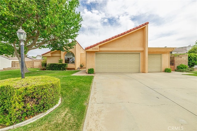 5340 Gardendale Ln, Palmdale, CA 93551 - view of front of house with stucco siding, driveway, a garage, and a tile roof