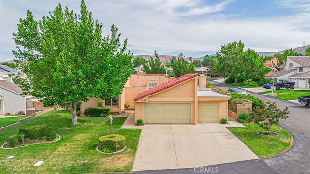 5340 Gardendale Ln, Palmdale, CA 93551 - view of front of house featuring stucco siding, a garage, a tiled roof, driveway, and a front lawn