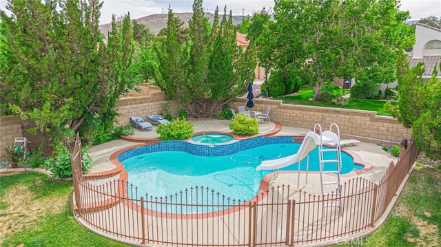 5340 Gardendale Ln, Palmdale, CA 93551 - view of pool featuring an in-ground hot tub, a fenced backyard, a patio area, and a water slide