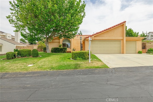 5340 Gardendale Ln, Palmdale, CA 93551 - view of front of property with a garage, driveway, stucco siding, and a tiled roof