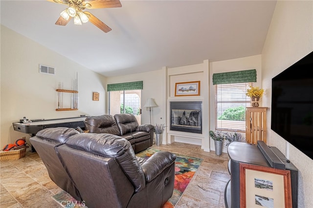5340 Gardendale Ln, Palmdale, CA 93551 - living room with vaulted ceiling, light stone finish floors, and ceiling fan