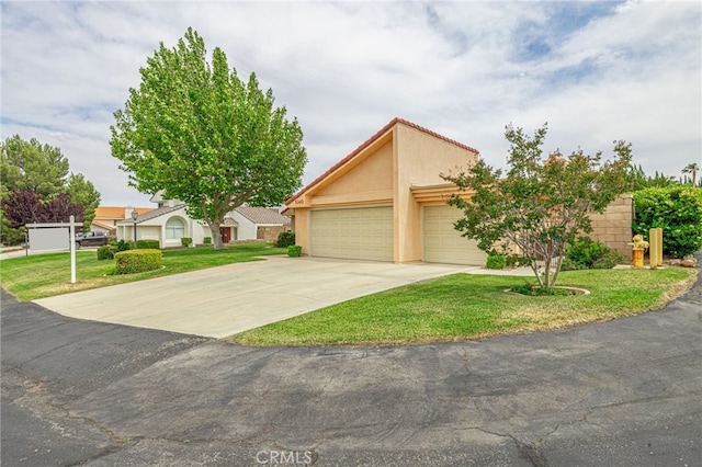 5340 Gardendale Ln, Palmdale, CA 93551 - view of front of home with a front lawn, driveway, a garage, and stucco siding