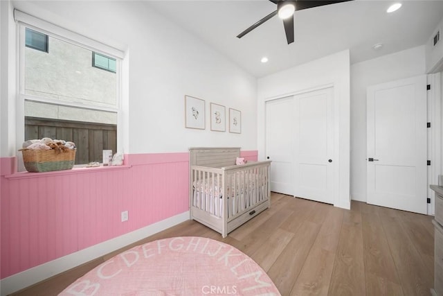 4019 Hillside Dr, San Luis Obispo, CA 93401 - bedroom featuring wainscoting, wood finished floors, a closet, recessed lighting, and ceiling fan