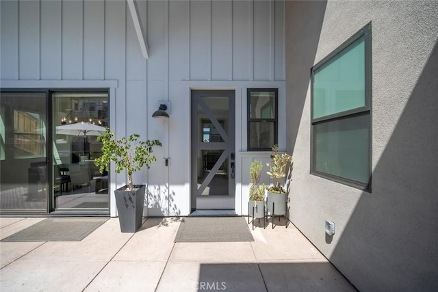 4019 Hillside Dr, San Luis Obispo, CA 93401 - view of exterior entry featuring board and batten siding and a patio area
