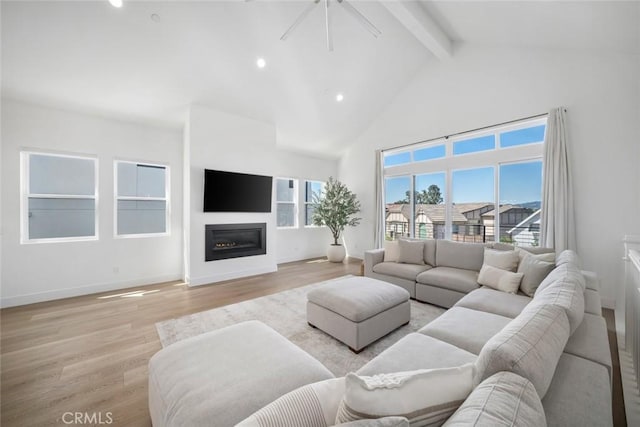 4019 Hillside Dr, San Luis Obispo, CA 93401 - living area with beamed ceiling, high vaulted ceiling, light wood-style floors, a glass covered fireplace, and recessed lighting