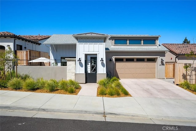 4019 Hillside Dr, San Luis Obispo, CA 93401 - view of front facade featuring a fenced front yard, board and batten siding, driveway, and an attached garage