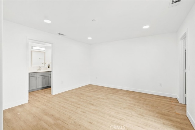 500 N Brannick Ave Unit 2, City Terrace, CA 90063 - empty room with light wood-type flooring, recessed lighting, baseboards, and a sink