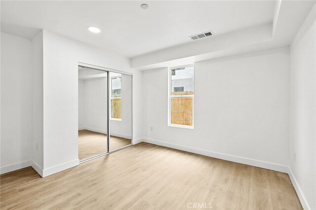 500 N Brannick Ave Unit 2, City Terrace, CA 90063 - unfurnished bedroom with light wood-style floors, baseboards, and a closet