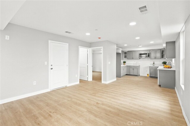 500 N Brannick Ave Unit 2, City Terrace, CA 90063 - unfurnished living room with recessed lighting, baseboards, and light wood-style flooring