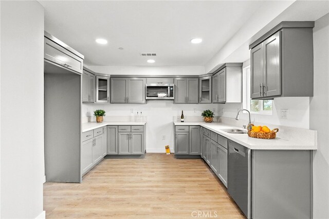 500 N Brannick Ave Unit 2, City Terrace, CA 90063 - kitchen with a sink, stainless steel appliances, gray cabinets, light wood-style floors, and recessed lighting