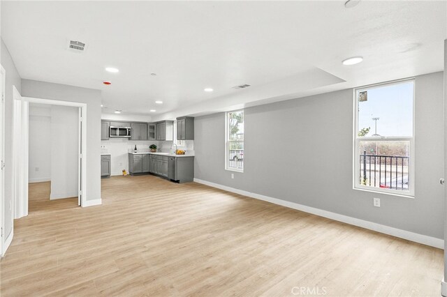 500 N Brannick Ave Unit 2, City Terrace, CA 90063 - unfurnished living room featuring baseboards, light wood-style floors, and recessed lighting