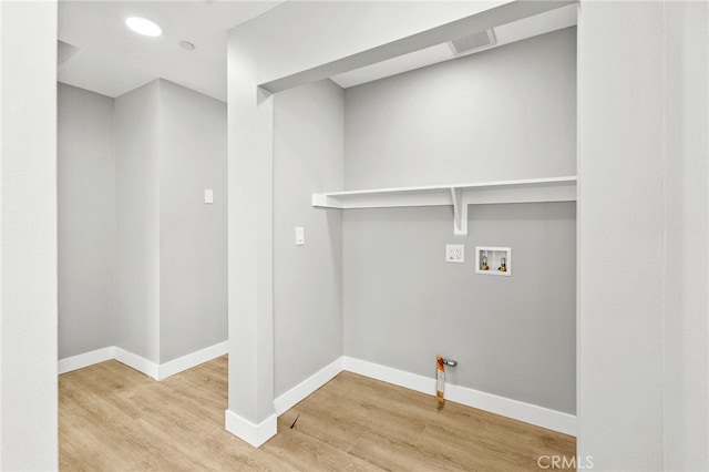 500 N Brannick Ave Unit 2, City Terrace, CA 90063 - washroom featuring wood finished floors, baseboards, and washer hookup