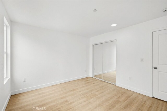 500 N Brannick Ave Unit 2, City Terrace, CA 90063 - unfurnished bedroom featuring light wood-style flooring, baseboards, a closet, and recessed lighting