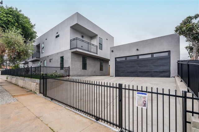 500 N Brannick Ave Unit 2, City Terrace, CA 90063 - contemporary house featuring a fenced front yard, stucco siding, and concrete driveway