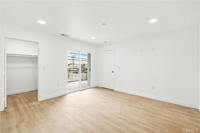500 N Brannick Ave Unit 2, City Terrace, CA 90063 - unfurnished bedroom featuring access to outside, light wood-type flooring, a spacious closet, baseboards, and recessed lighting