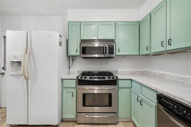 3206 4th St, Clearlake, CA 95422 - kitchen with stainless steel appliances and green cabinets