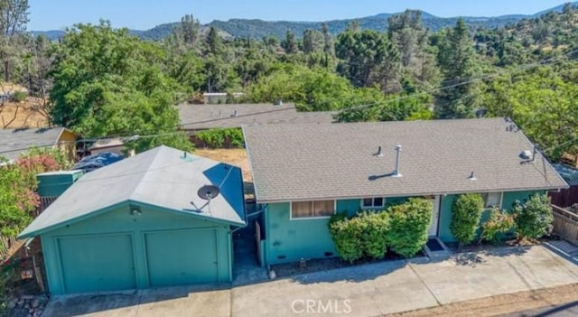 3206 4th St, Clearlake, CA 95422 - view from above of property with a mountainous background and a heavily wooded area
