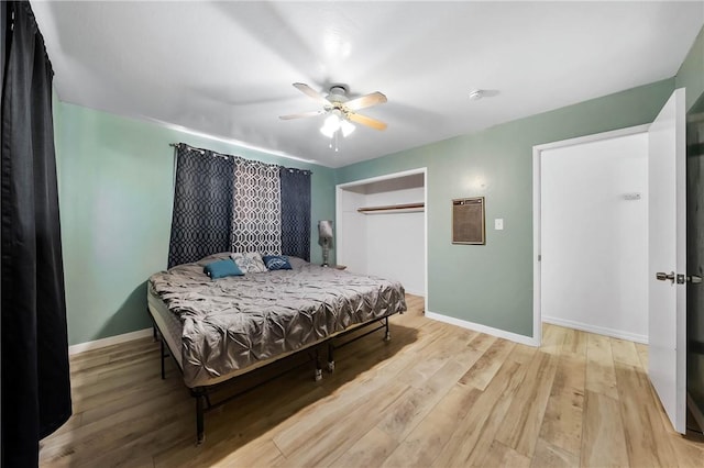 3206 4th St, Clearlake, CA 95422 - bedroom with baseboards, wood finished floors, a closet, and a ceiling fan