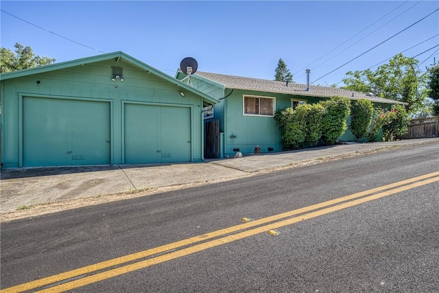 3206 4th St, Clearlake, CA 95422 - ranch-style home featuring concrete driveway and an attached garage