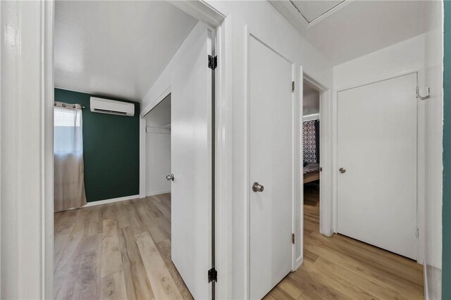 3206 4th St, Clearlake, CA 95422 - hall with an AC wall unit and light wood-style floors
