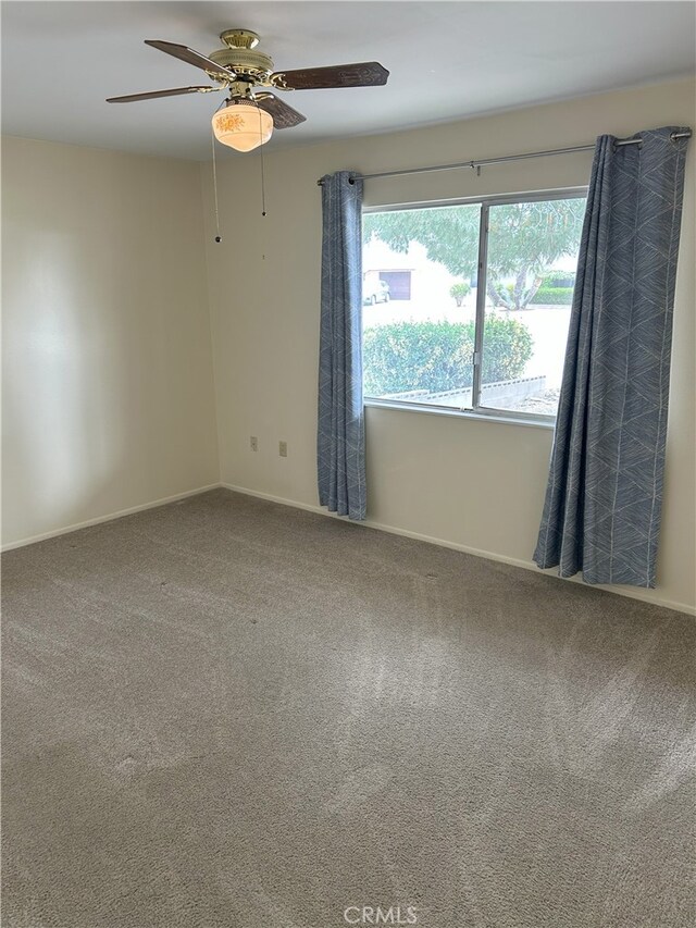 28711 Del Monte Dr, Menifee, CA 92586 - carpeted empty room with a ceiling fan and baseboards