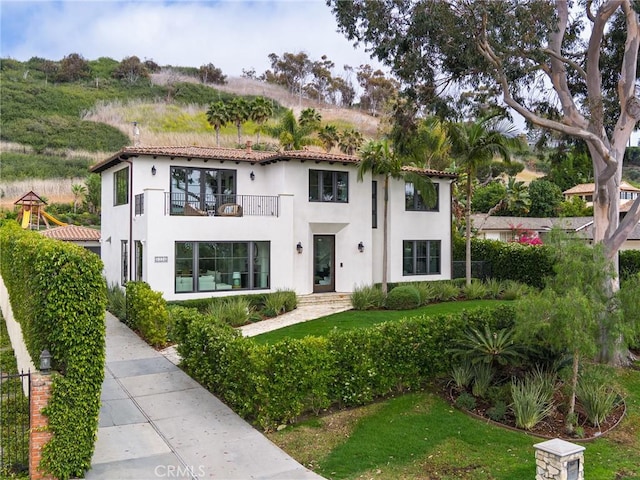 1336 Palos Verdes Dr W, Palos Verdes Estates, CA 90274 - mediterranean / spanish-style home featuring a balcony, stucco siding, and a front yard