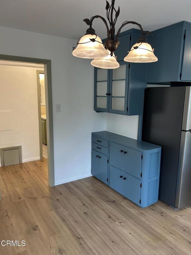 5621 Carlota Blvd, Los Angeles, CA 90042 - unfurnished dining area with light wood-style floors and baseboards