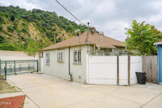 5621 Carlota Blvd, Los Angeles, CA 90042 - back of house with stucco siding and a patio