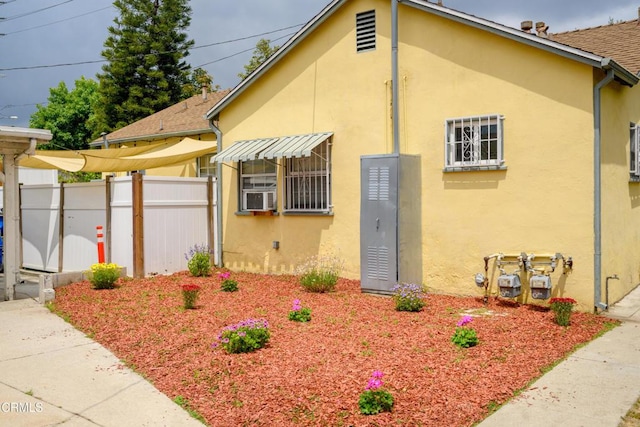 5621 Carlota Blvd, Los Angeles, CA 90042 - view of property exterior with stucco siding, cooling unit, and a shingled roof