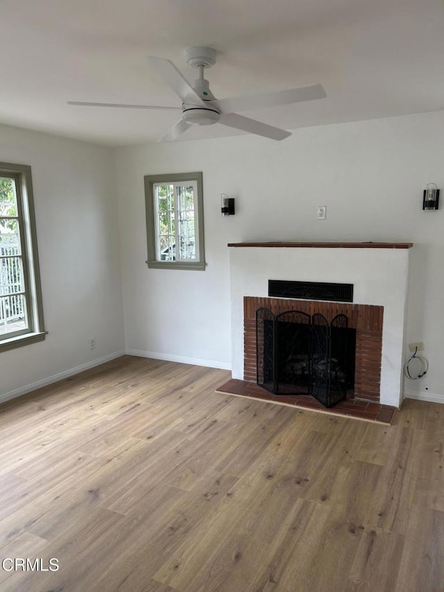 5621 Carlota Blvd, Los Angeles, CA 90042 - unfurnished living room featuring a fireplace, wood finished floors, ceiling fan, and baseboards