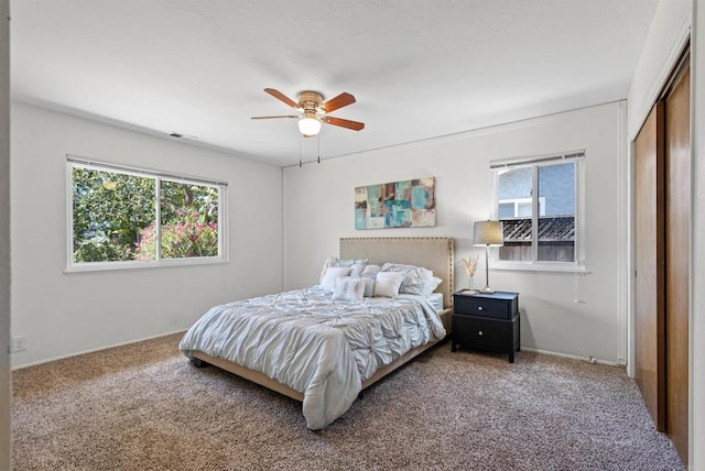 2745 La Gran Via, Carlsbad, CA 92009 - carpeted bedroom with multiple windows, baseboards, and ceiling fan