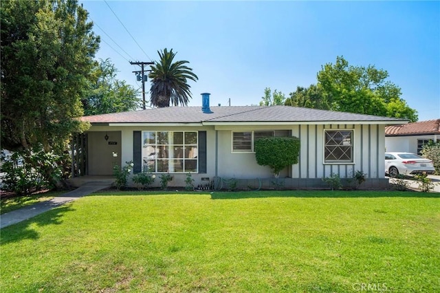1714 N Towner St, Santa Ana, CA 92706 - ranch-style house with board and batten siding, a front yard, and a shingled roof