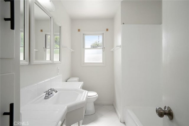 1714 N Towner St, Santa Ana, CA 92706 - bathroom with toilet, vanity, tile patterned flooring, baseboards, and washtub / shower combination