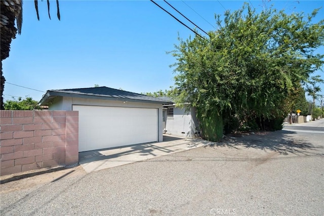 1714 N Towner St, Santa Ana, CA 92706 - view of front of house featuring a garage and stucco siding