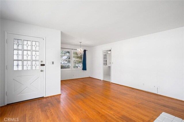 1714 N Towner St, Santa Ana, CA 92706 - foyer with a chandelier and wood finished floors