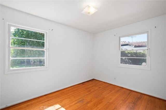 1714 N Towner St, Santa Ana, CA 92706 - spare room with plenty of natural light, light wood-type flooring, and baseboards