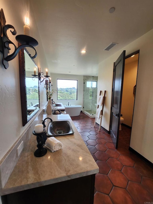 1010 Willowcreek Ln, Fallbrook, CA 92028 - kitchen with light countertops, dark tile patterned floors, and recessed lighting