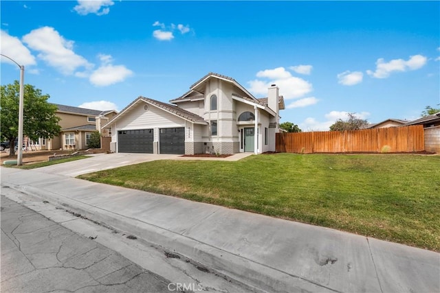 42346 W 47th St W, Lancaster, CA 93536 - view of front of property featuring an attached garage, driveway, a chimney, brick siding, and stucco siding