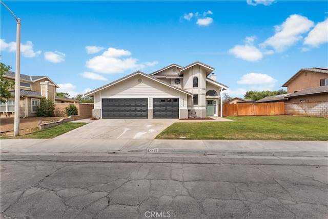 42346 W 47th St W, Lancaster, CA 93536 - view of front of home with a garage, driveway, and brick siding