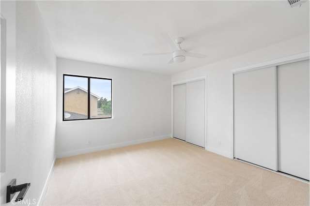 42346 W 47th St W, Lancaster, CA 93536 - unfurnished bedroom with multiple closets, carpet flooring, baseboards, and a ceiling fan