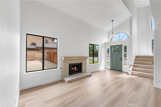 42346 W 47th St W, Lancaster, CA 93536 - entrance foyer featuring wood finished floors, high vaulted ceiling, baseboards, and stairway