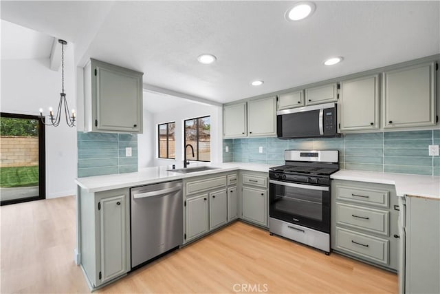 42346 W 47th St W, Lancaster, CA 93536 - kitchen featuring appliances with stainless steel finishes, a sink, gray cabinets, light countertops, and light wood-style flooring
