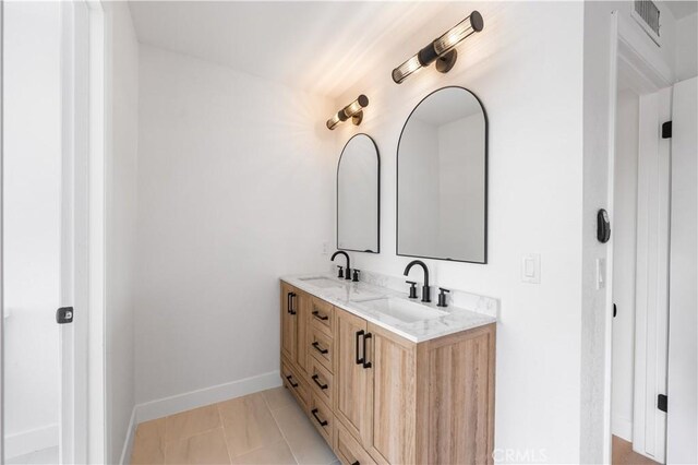 42346 W 47th St W, Lancaster, CA 93536 - full bathroom with double vanity and baseboards