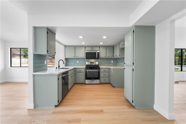 42346 W 47th St W, Lancaster, CA 93536 - kitchen featuring stainless steel appliances, baseboards, backsplash, gray cabinets, and recessed lighting