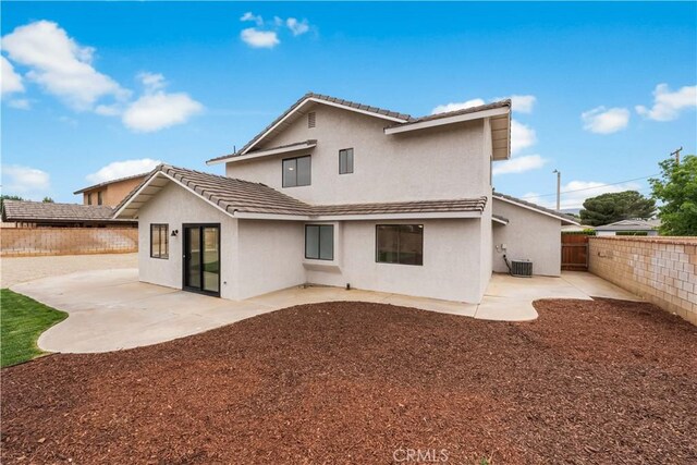 42346 W 47th St W, Lancaster, CA 93536 - back of property featuring stucco siding, a fenced backyard, and a patio