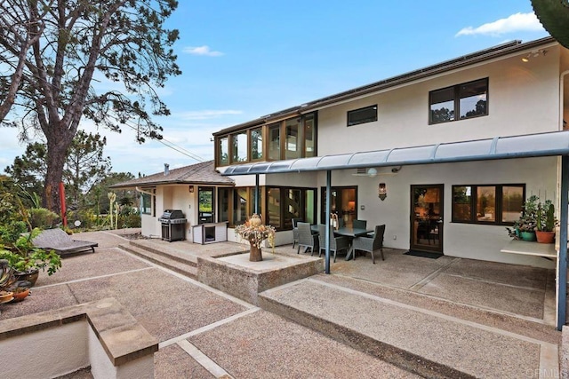 1859 Zapo St, Del Mar, CA 92014 - back of property featuring stucco siding, a patio area, outdoor dining area, and area for grilling